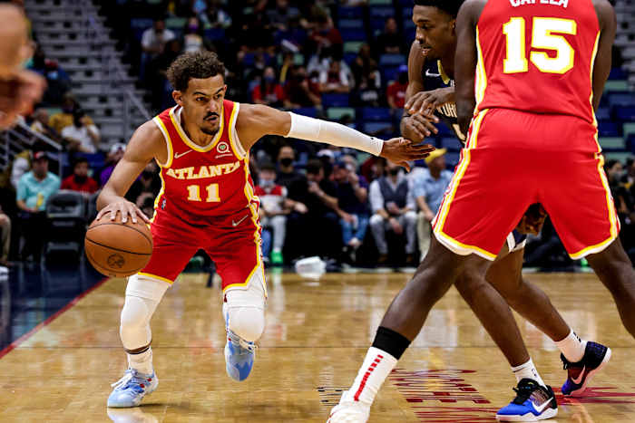 Atlanta Hawks guard Trae Young (11) dribbles against New Orleans Pelicans during the first half at the Smoothie King Center.